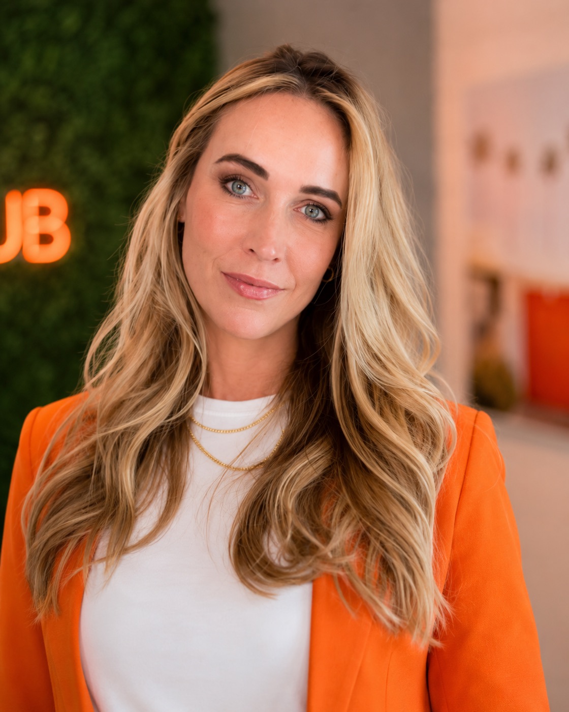 Jam in her signature orange blazer