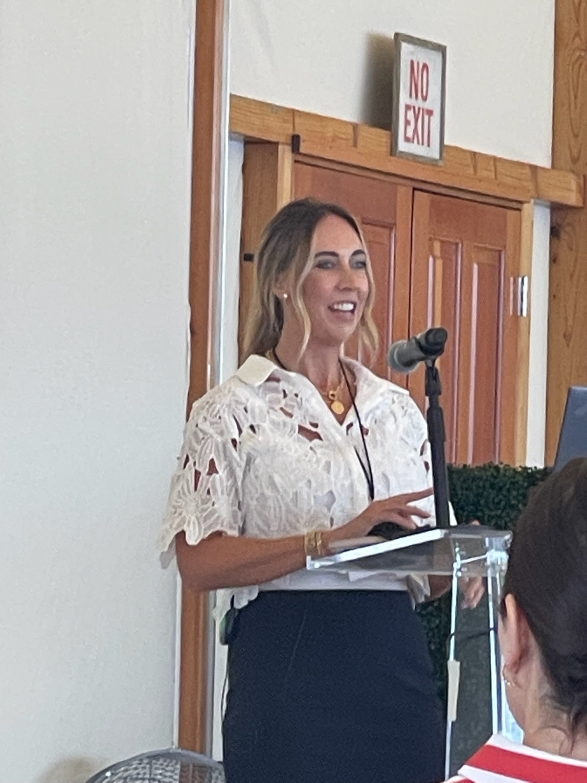 Jam speaking at a podium in Newport